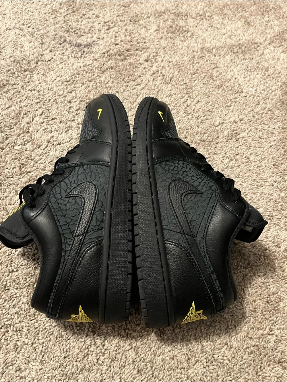 Jordan 1 Black Low-Top Sneakers with Yellow Accents